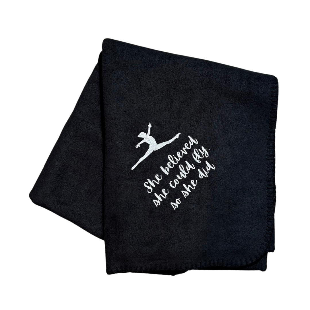 Black blanket with white text and graphic