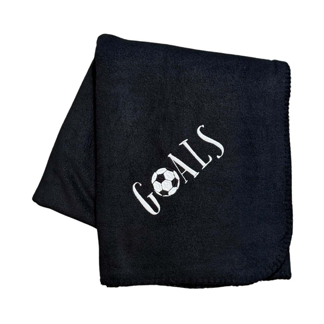 Black blanket with 'GOALS' and a soccer ball design