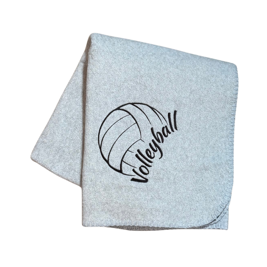 Light gray blanket with volleyball design and 'Volleyball' text in black
