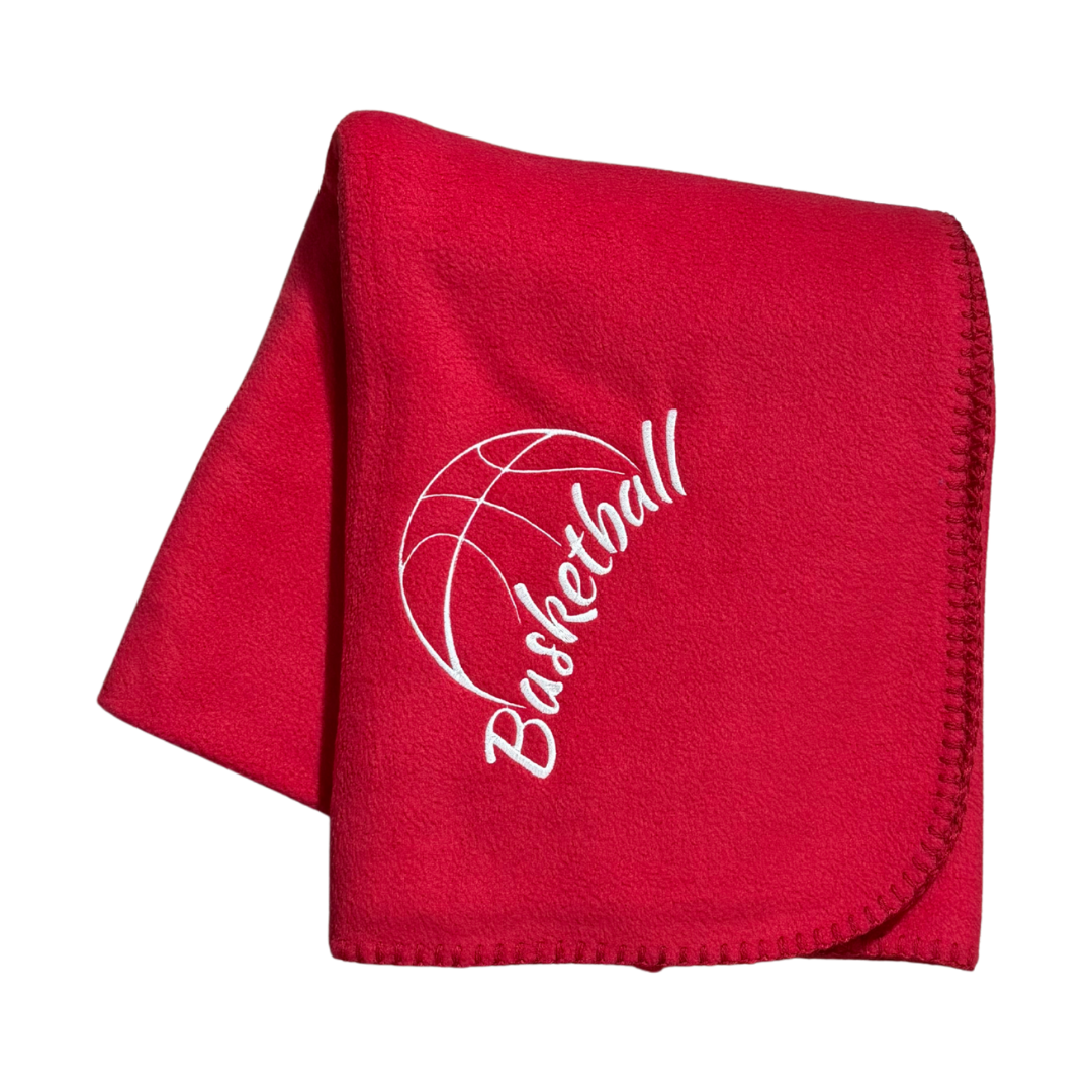 Red fleece blanket with 'Basketball' and a basketball icon in white stitching