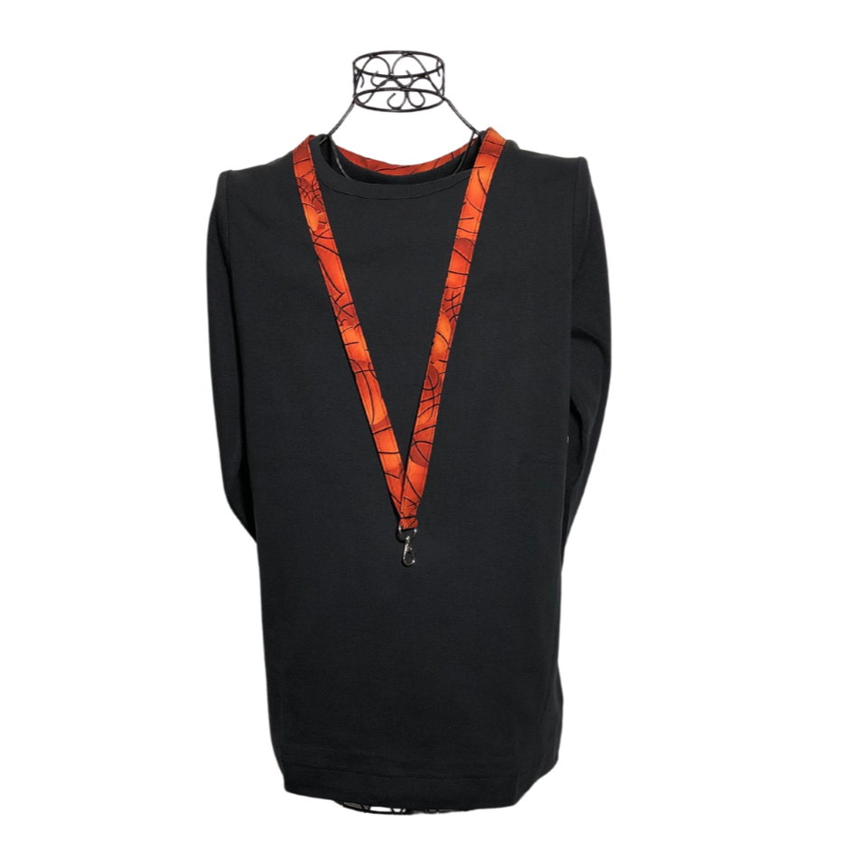 orange basketball lanyard on a mannequin with a black shirt