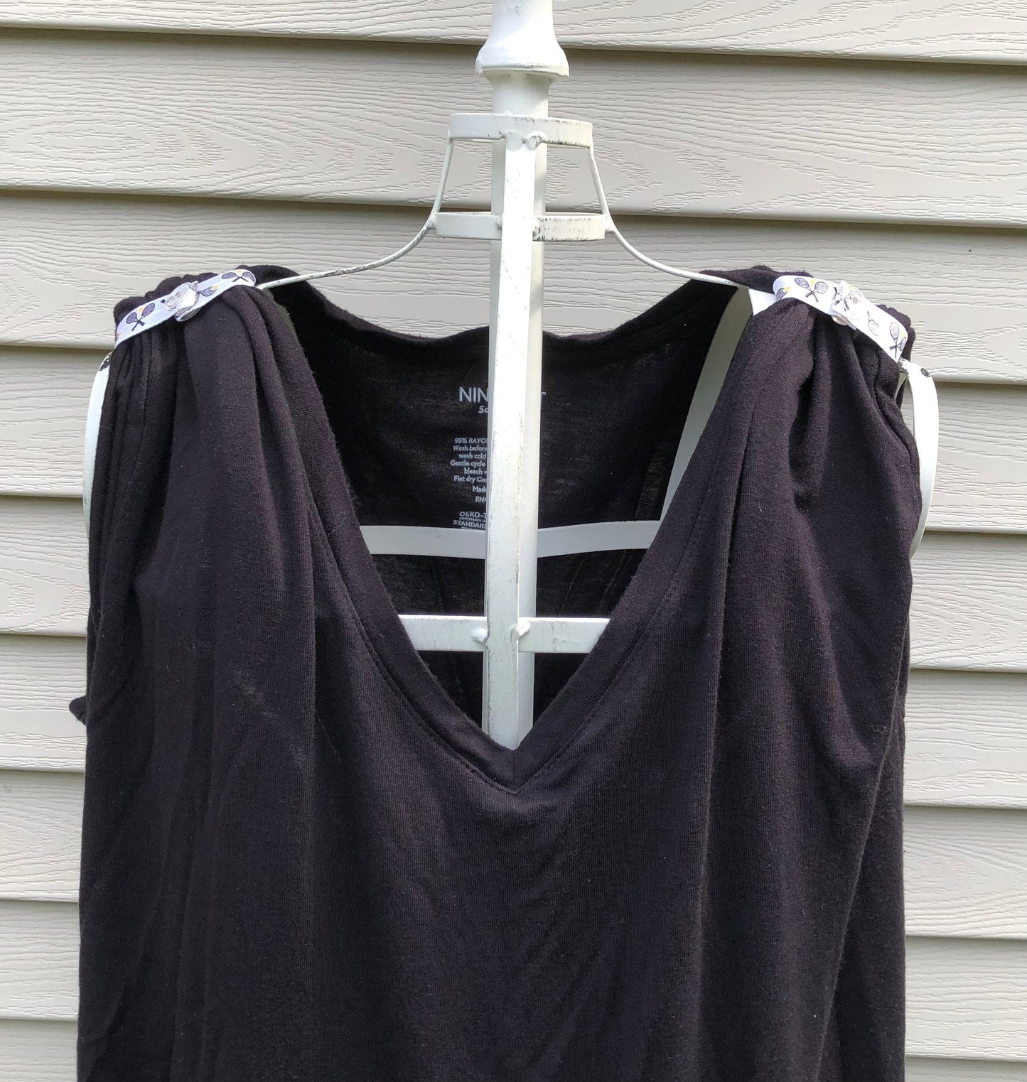 black tshirt on mannaquin with sleeve clips