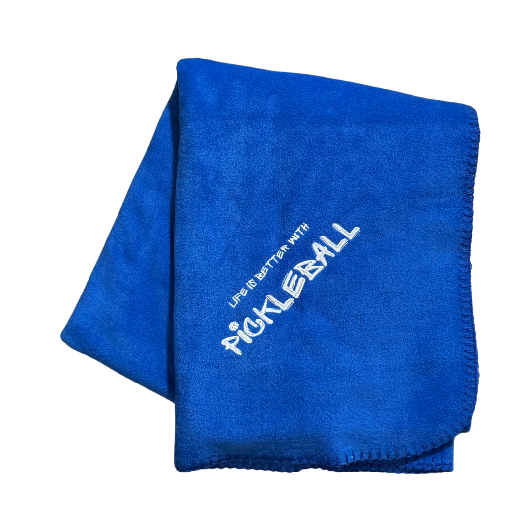 Blue blanket with 'Pickleball' text in white stitching