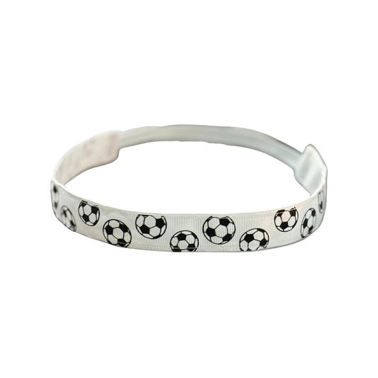 White headband with black and white soccer ball pattern on a white background