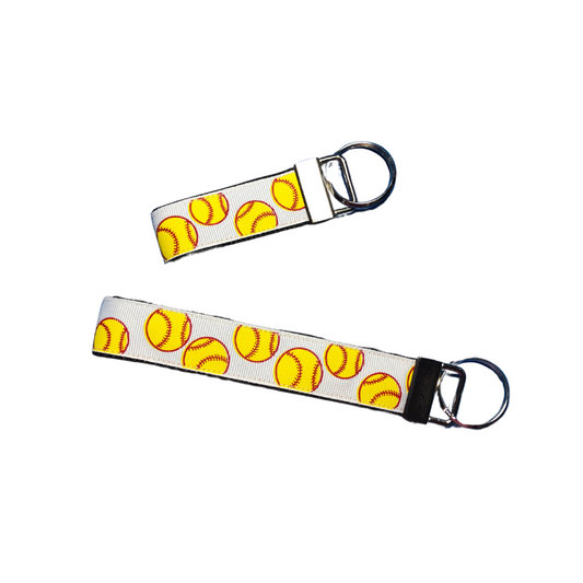 pair of two white softball keychains