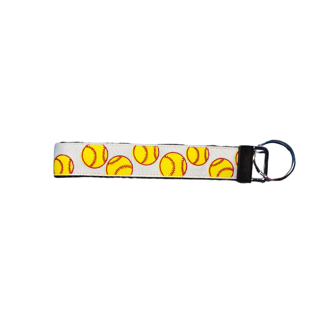 white wristlet keychain with yellow softballs