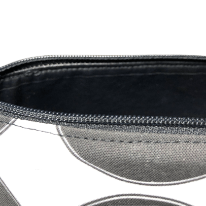 black vinyl interior of zippered pouch