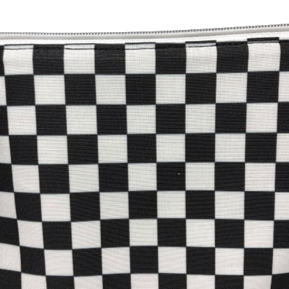 white zipper on checkerboard cosmetic bag