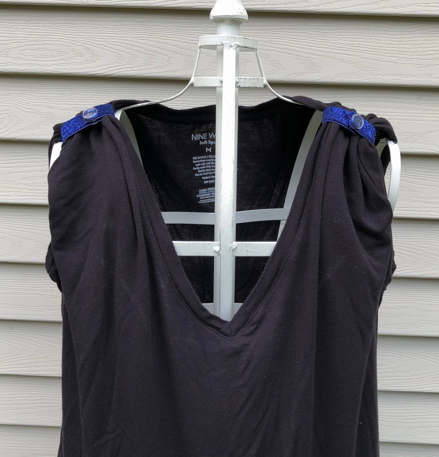 sparkly navy blue sleeve clips on black tshirt