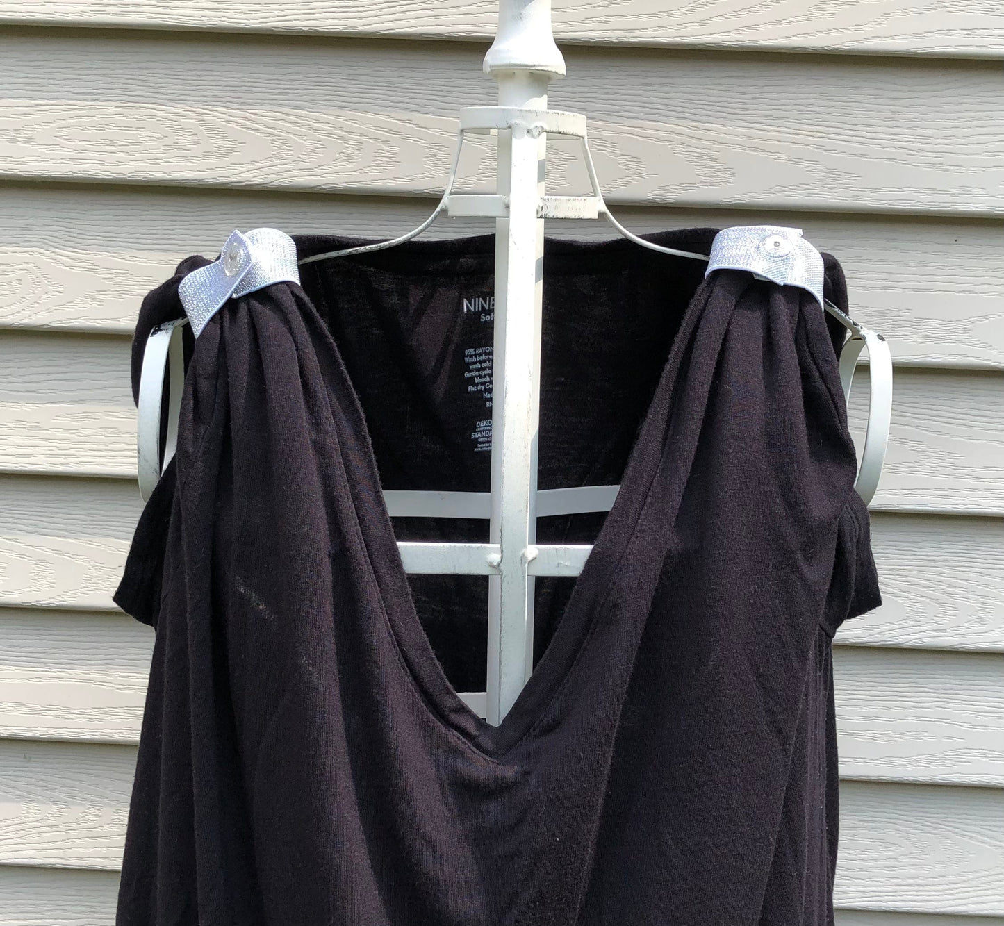 silver sleeve clips on black tshirt