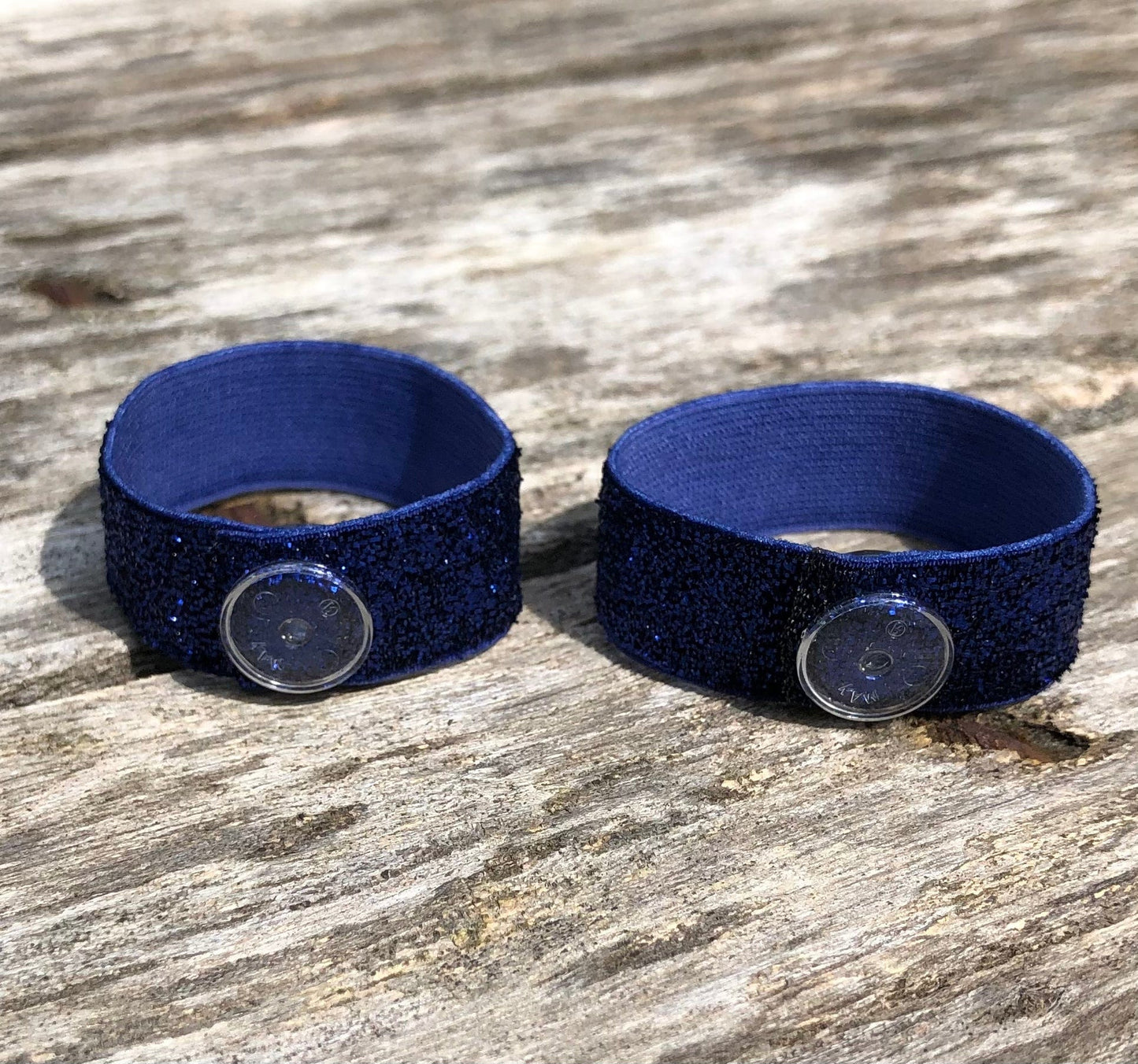 pair of navy blue sparkly sleeve clips