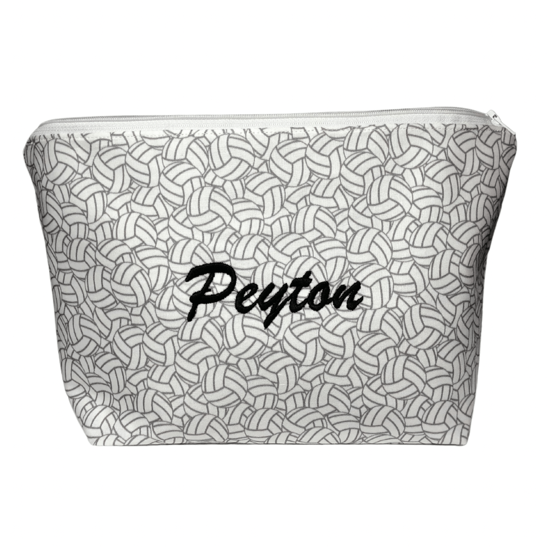 zippered bag with volleyball fabric and name Peyton in black at center of bag