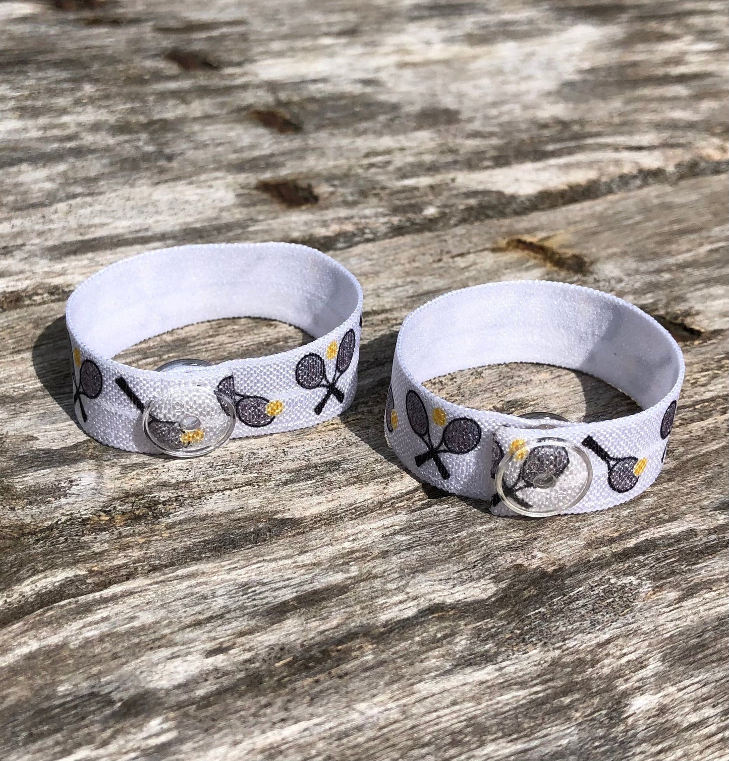 pair of white tennis themed sleeve clips