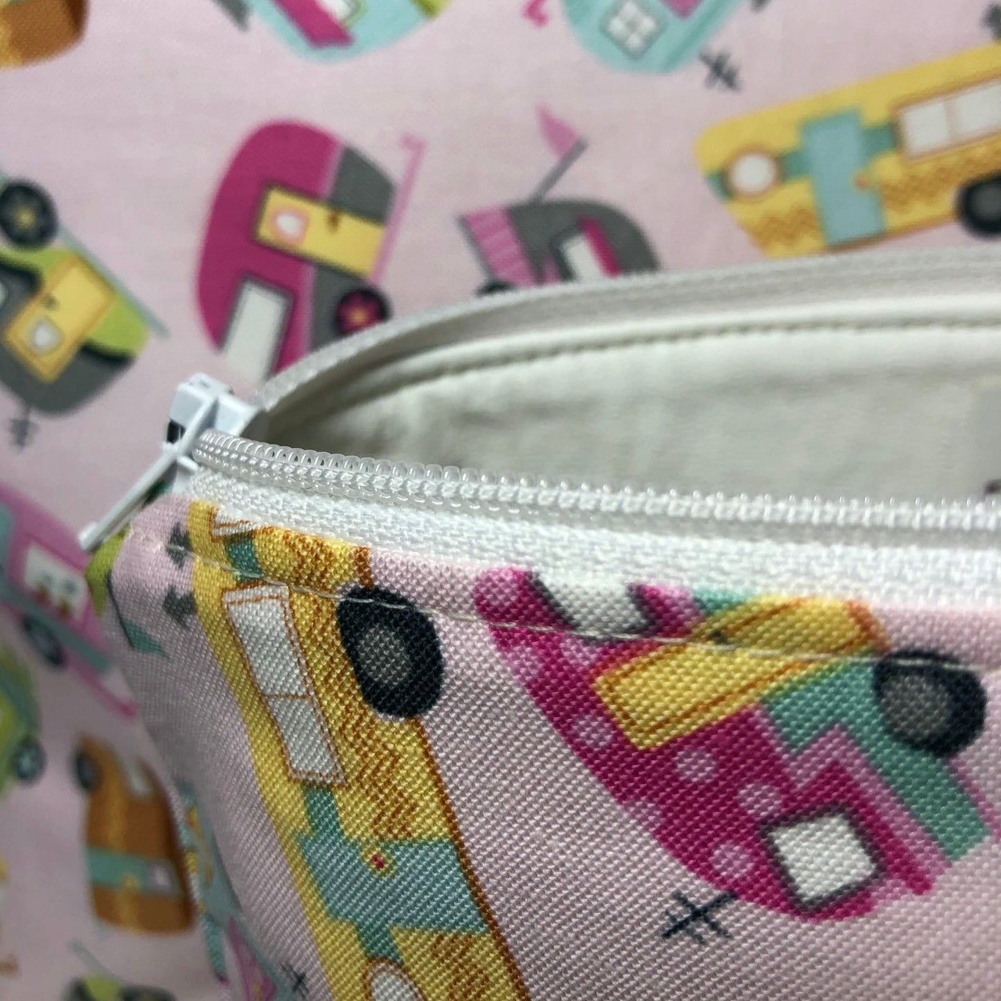 white lining and zipper on pink camper makeup bag