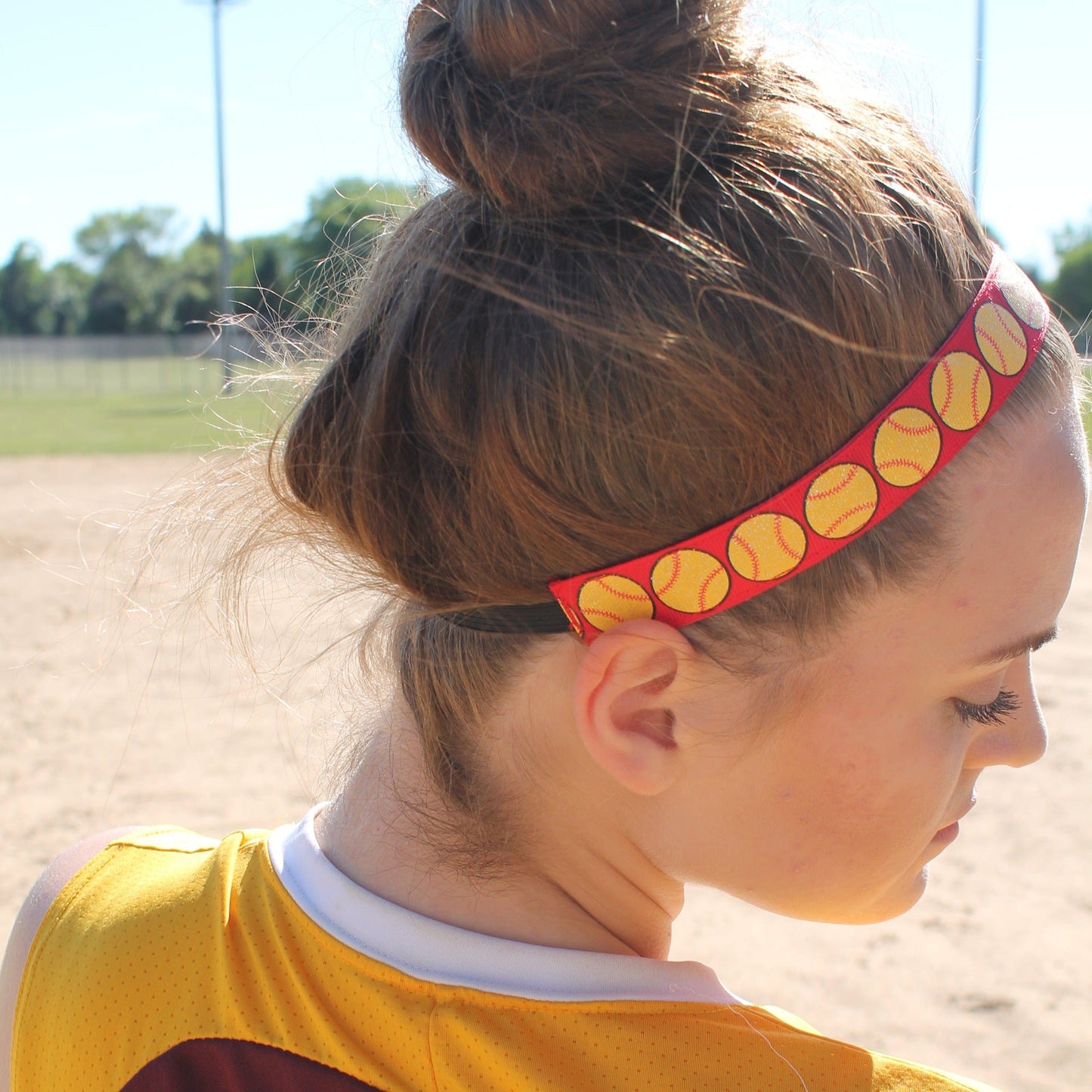 red softball headband with glittery yellow softballs