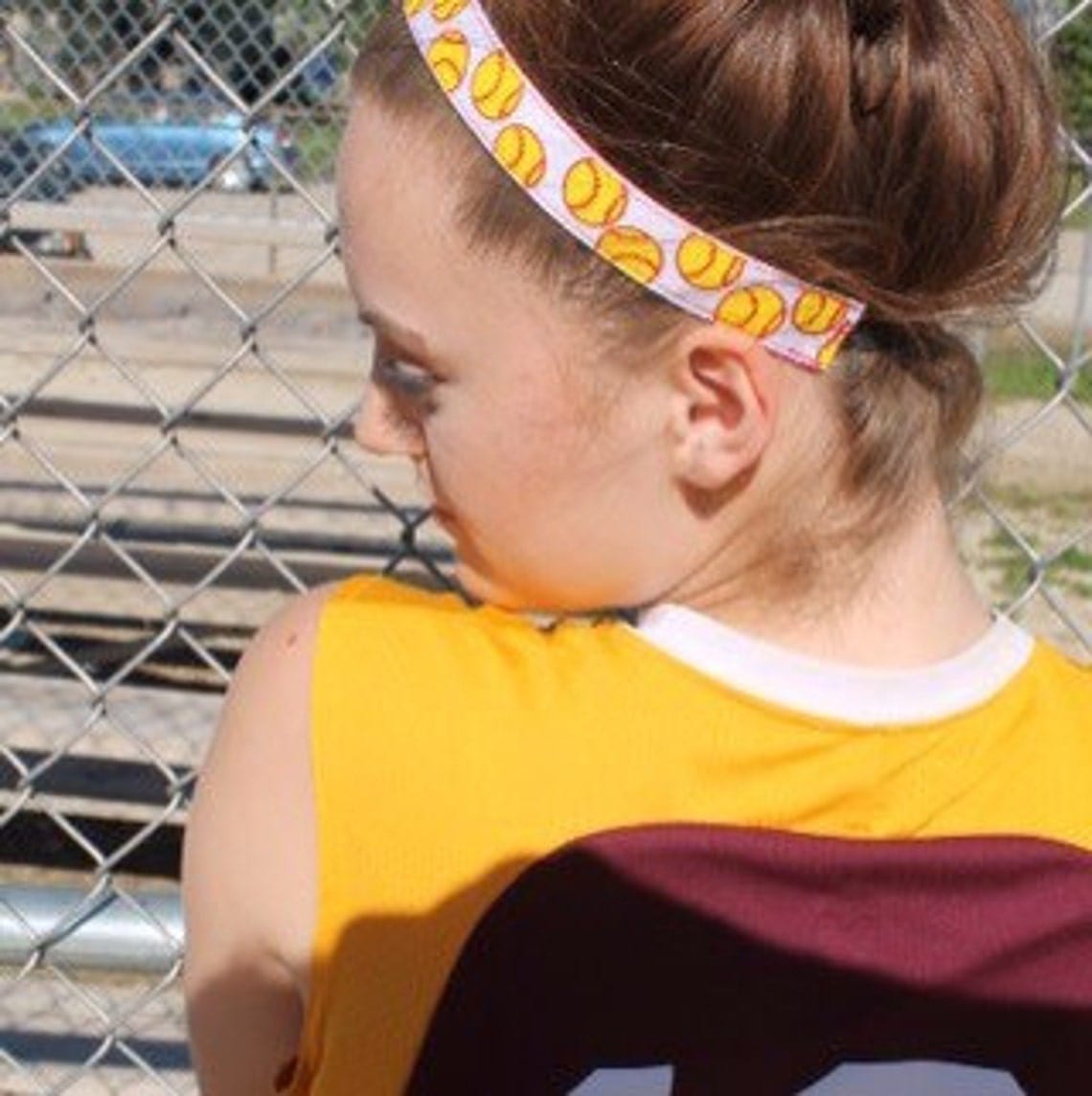 white softball headband with yellow softballs