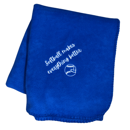 royal blue softball blanket that says softball makes everything bettter with a heart in a softball