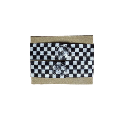 Checkered black and white ribbon sleeve clips with two clear buttons