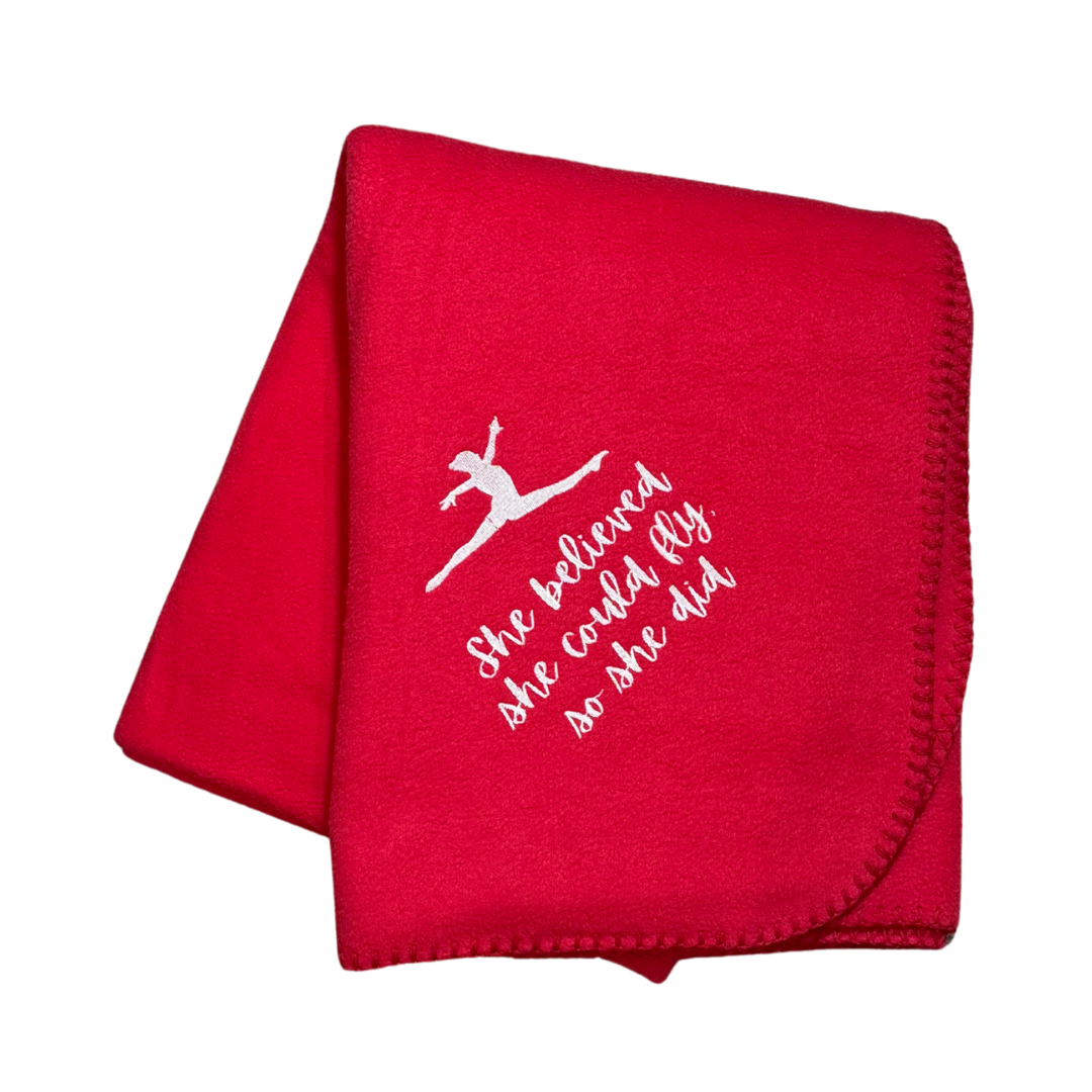 Red blanket  for gymnastics with white text and graphic