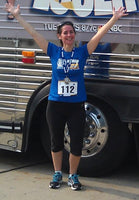 Maggie Eastman wearing a medal after the Biggest Loser 5K in Racine WI