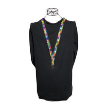 Load image into Gallery viewer, mannequin wearing a black shirt with a autism awareness lanyard
