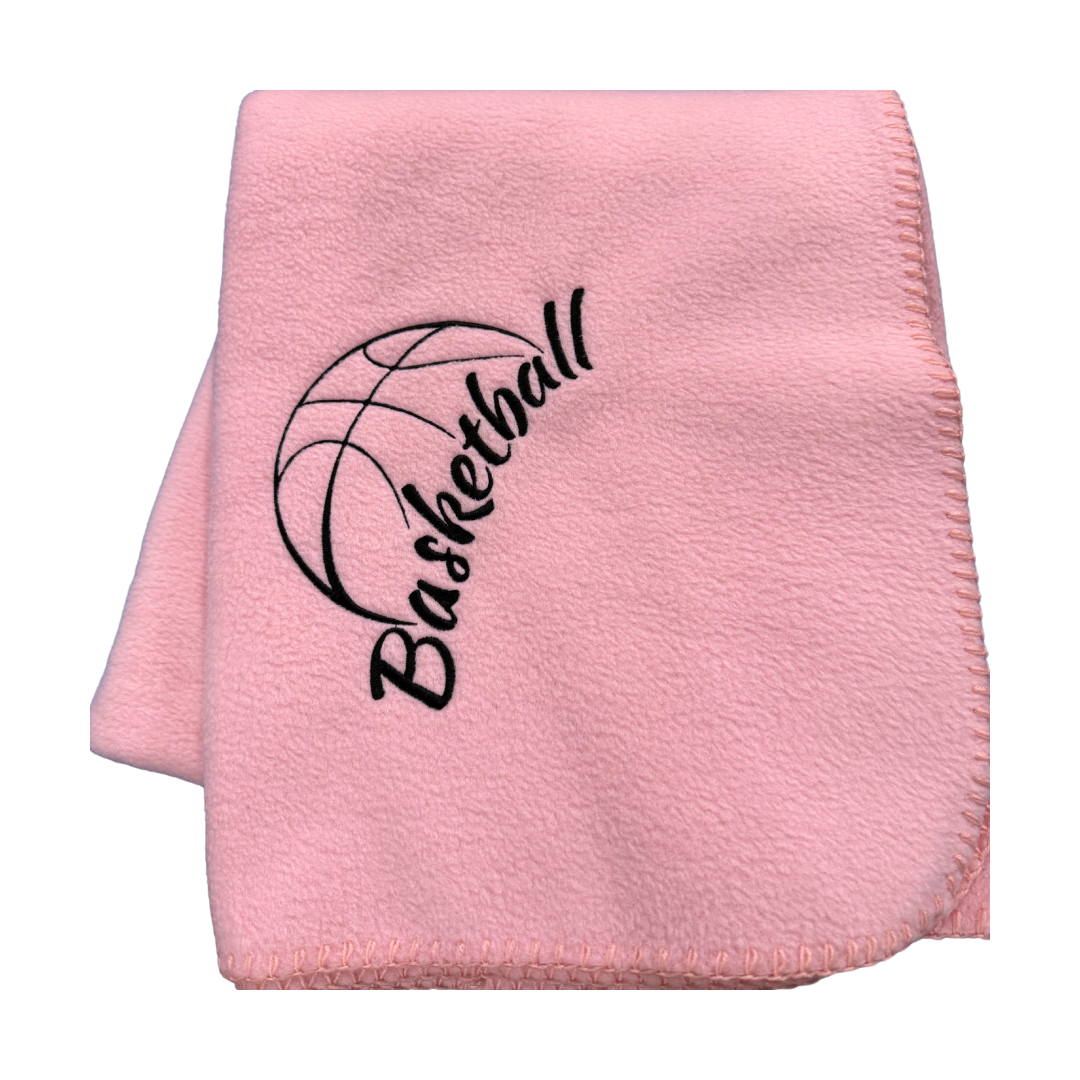 Pink blanket with 'Basketball' and basketball icon in black embroidery
