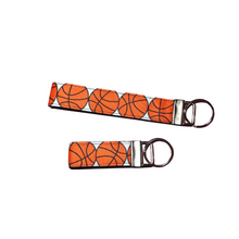 Load image into Gallery viewer, set of basketball keychains - one wristlet and one mini

