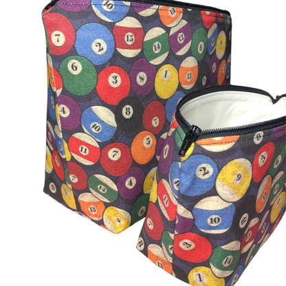 side view of billiard makeup bags with boxed out bottom and colorful pool balls