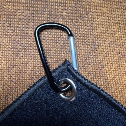 Black carabiner attached to a black microfiber towel