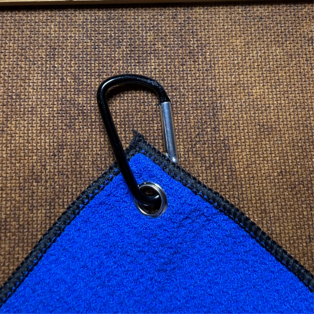 Blue towel with a black carabiner
