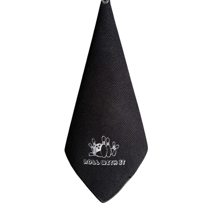 Black towel with white graphic and text 'Roll With It' on a white background