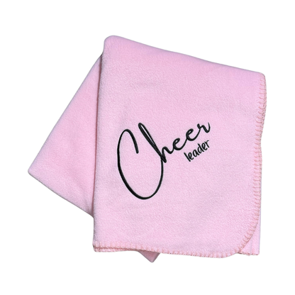 pink fleece blanket with cheerleader in black embroidery