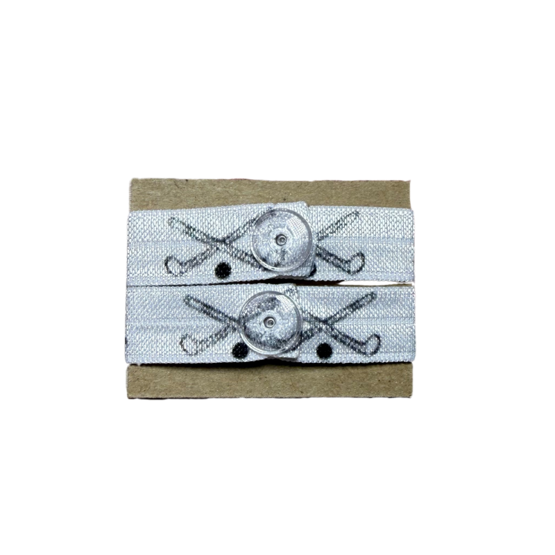 Two sleeve clips in black and white with field hockey sticks