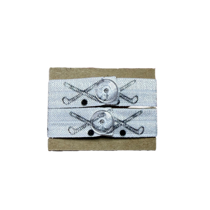 Two sleeve clips in black and white with field hockey sticks