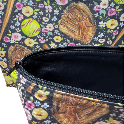 Floral-patterned bag with softball design, open to reveal black interior vinyl lining