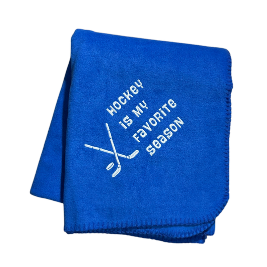 blue hockey blanket with embroidery in white thread