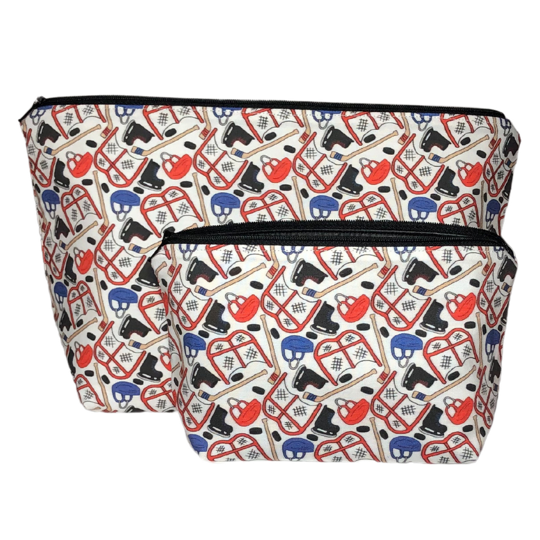 red and blue hockey makeup bag set with hockey gear printed on the fabric