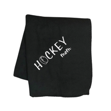 Load image into Gallery viewer, black hockey mom blanket with white stitching and a hockey puck as the O in hockey
