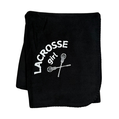 black lacrosse blanket with lacrosse girl and sticks embroidered in white