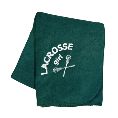 green lacrosse blanket with lacrosse girl and sticks embroidered in white