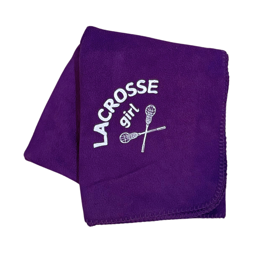 purple  lacrosse blanket with lacrosse girl and sticks embroidered in white