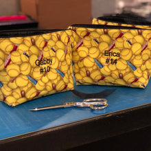 Load image into Gallery viewer, two yellow softball makeup bags with embroidered names Gabby #10 and Erica #14 in the center
