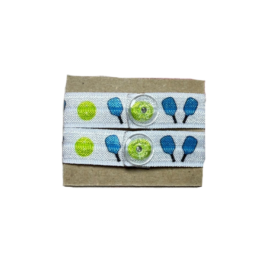 set of two pickleball sleeve clips with blue paddles and yellow balls
