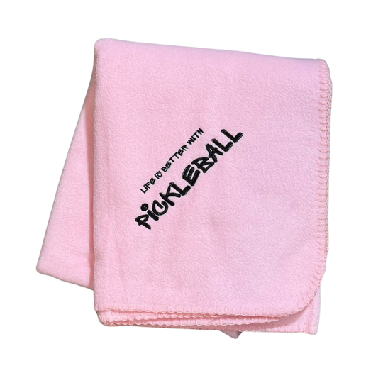 Pink blanket with 'Life is better with Pickleball' text in black embroidery