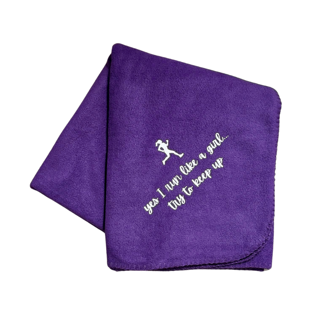 Purple blanket with white text and running silhouette