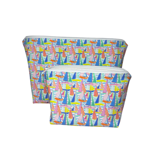 Two pouches with colorful sailboat pattern on a white background