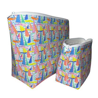 Two colorful bags with sailboat pattern on a white background