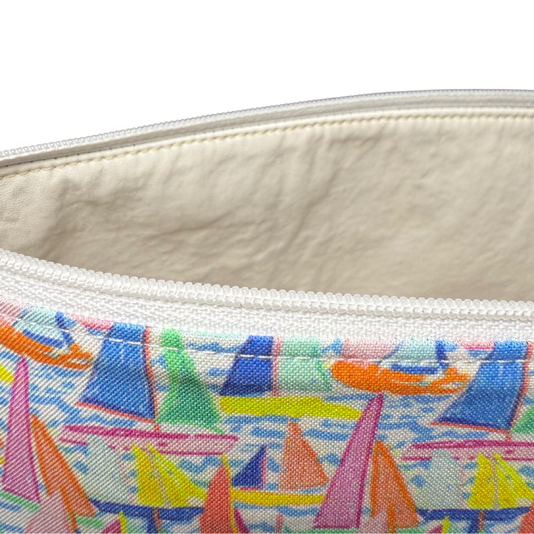 Close-up of a pouch with colorful sailboat design on a white background