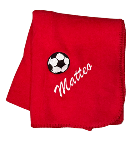 Custom red soccer blanket with black and white soccer ball and white embroidered personalized name