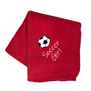red soccer blanket with black and white soccer ball and soccer girl stitched underneath the ball